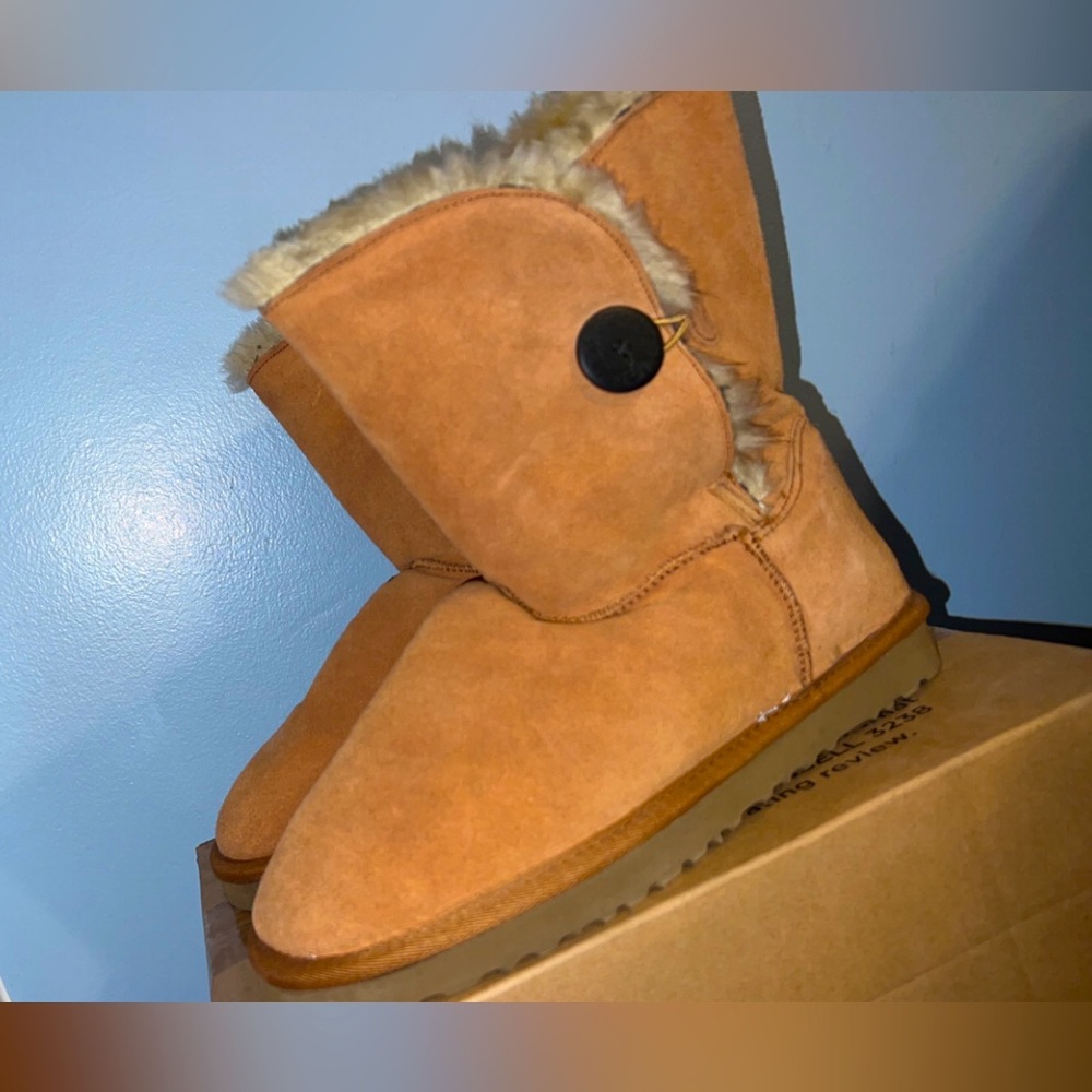 Never Worn Before. 
Chestnut Uggs with Brown Button on the side.
